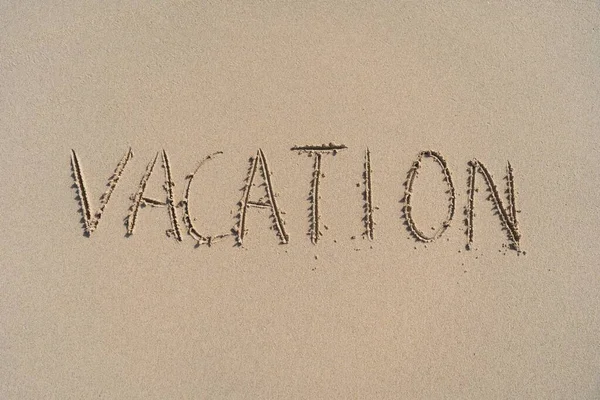 Vacation inscription on summer sandy beach. Leisure and adventure concept — Stock Photo, Image