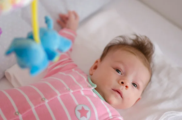 Baby in a cot — Stock Photo, Image