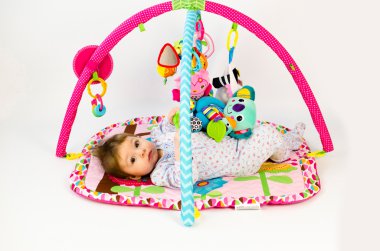 baby girl palying in an activity gym clipart