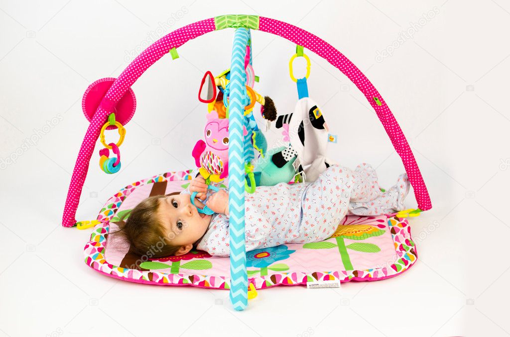 baby girl palying in an activity gym