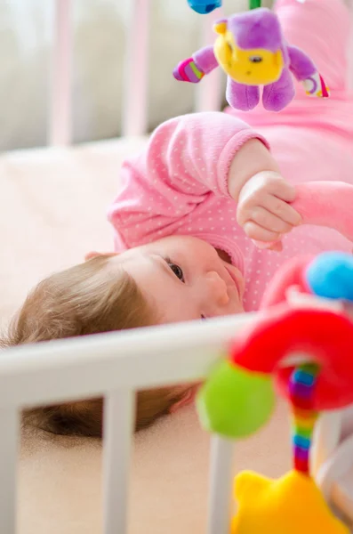 Baby in a cot — Stock Photo, Image