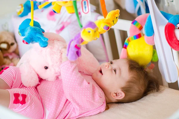 Baby in a cot — Stock Photo, Image