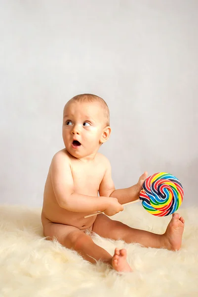Baby boy with lollipop — Stock Photo, Image