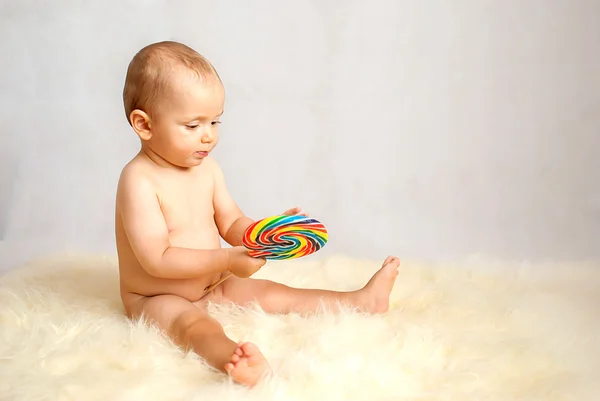 Baby boy with lollipop — Stock Photo, Image