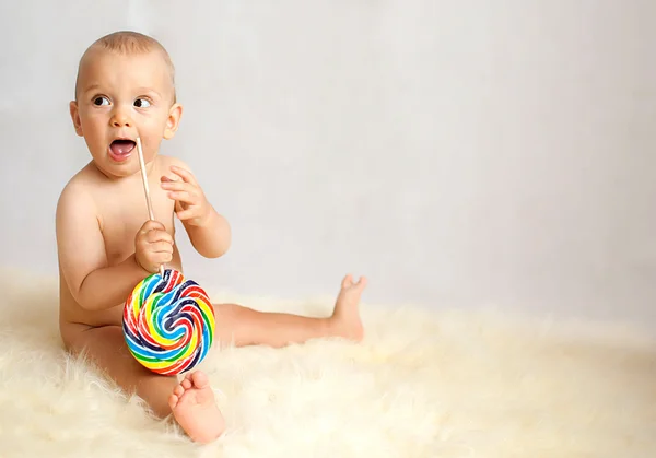 Baby boy with lollipop — Stock Photo, Image