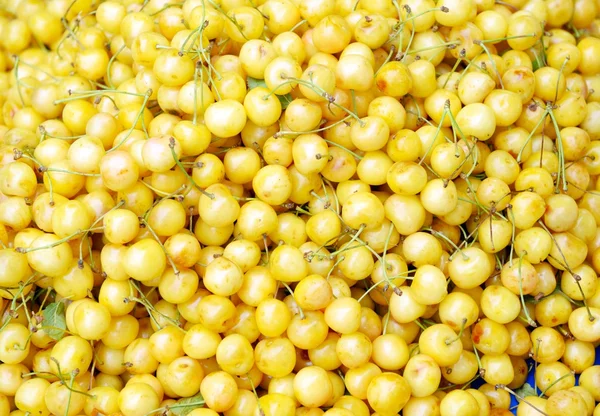 Yellow cherries background — Stock Photo, Image