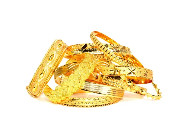 Gold bracelets on white Stock Picture