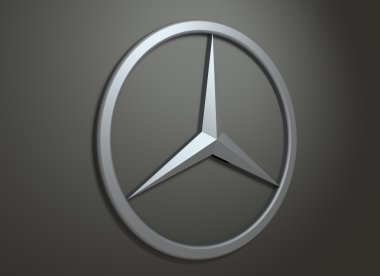 Koyu gri arka plan üzerinde Mercedes Benz amblemi.