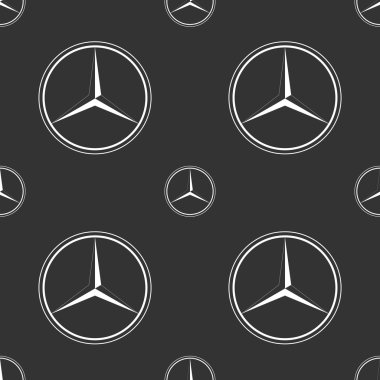 Koyu gri arka plan üzerinde Mercedes Benz amblemi.
