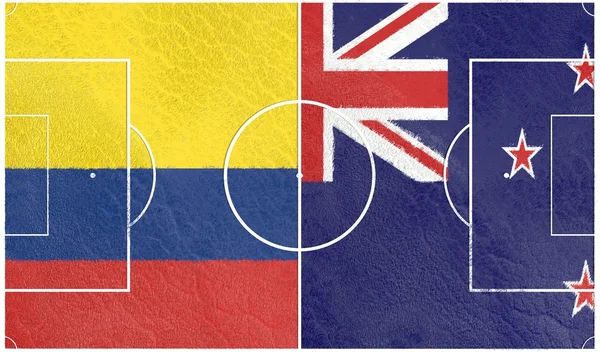 Colombia vs New Zealand. Football field textured by flags — Stock Photo, Image