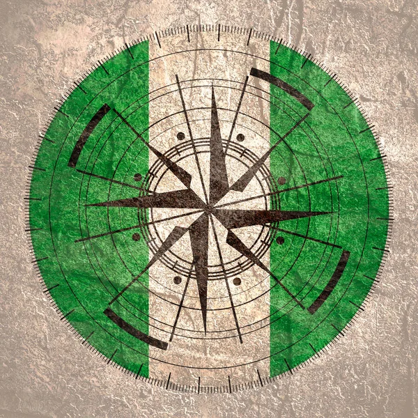 Символ компаса на геометрии и национальном флаге — стоковое фото
