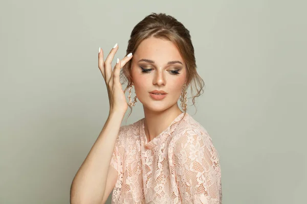 Lovely young woman on white background