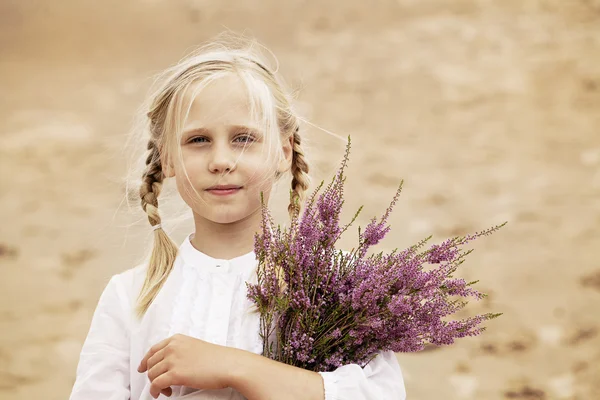 Cute Child Girl with Heather Flowers Outdoors — Stockfoto