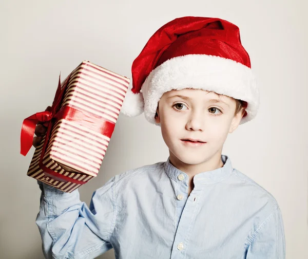 What is in the Christmas Box? Child with Christmas Gift and Sant — Stok fotoğraf