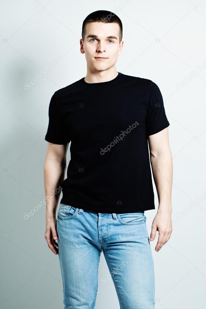 Guy Wearing Black T-Shirt and Blue Jeans