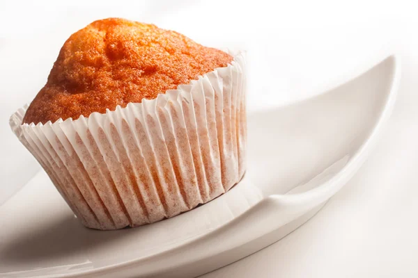 Muffin on white plate — Stock Photo, Image