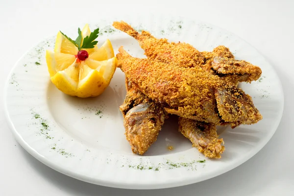 The breaded fish in corn with lemon — Stock Photo, Image