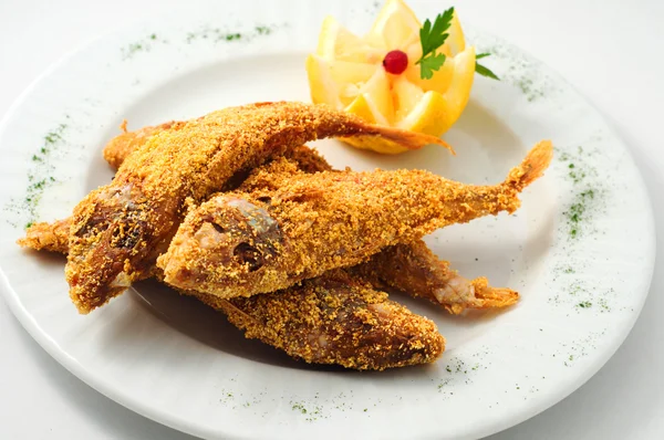 The breaded fish in corn with lemon — Stock Photo, Image