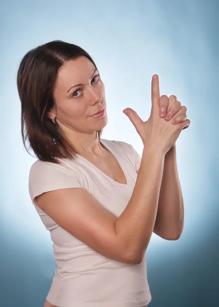 Mulher com o dedo indicador para baixo ou para cima isolado — Fotografia de Stock
