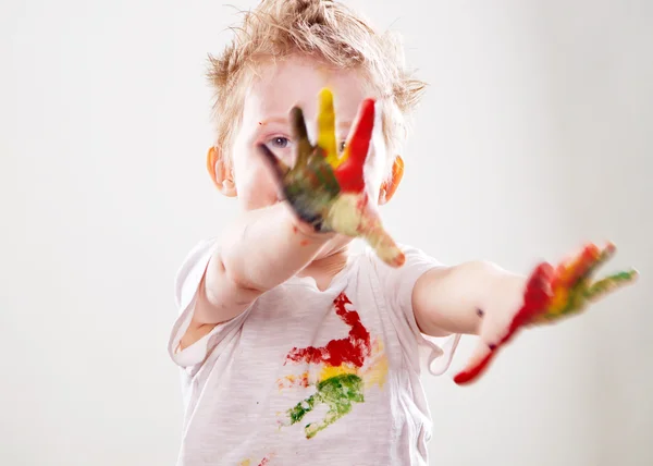 The baby boy with  gouache soiled hands and shirt isolated — Stock Photo, Image