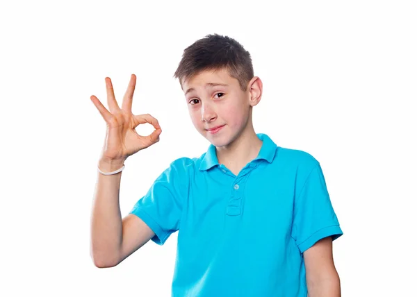 Portrait of a boy pointing finger showing emotions expressive  on a white background with a blue shirt — Stock Photo, Image