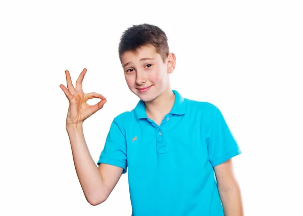 Portrait of a boy pointing finger showing emotions expressive  on a white background with a blue shirt — Stock Photo, Image