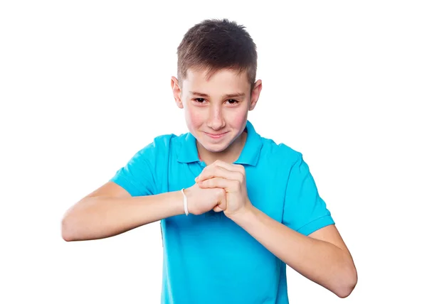 Retrato de um menino apontando o dedo mostrando emoções expressivas em um fundo branco com uma camisa azul — Fotografia de Stock