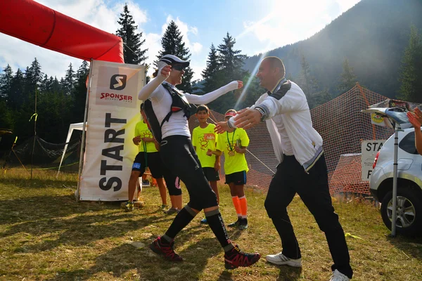 Trail running athlete finishing the race — Stock Photo, Image