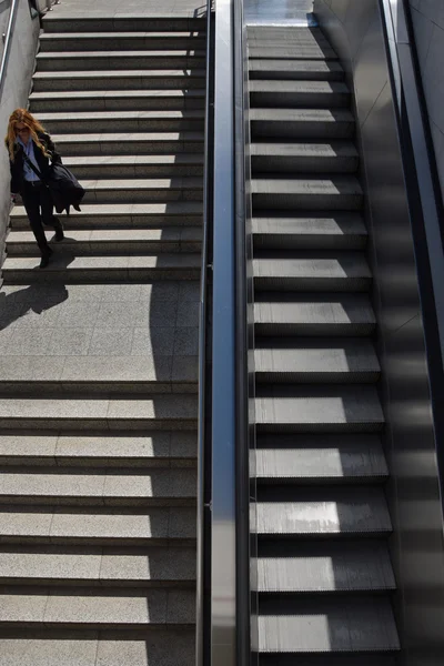 woman subway steps