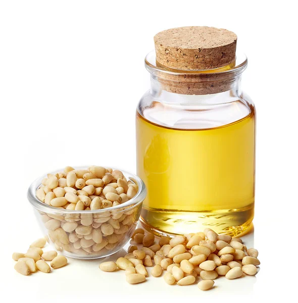 Pine nut oil and pine nuts — Stock Photo, Image