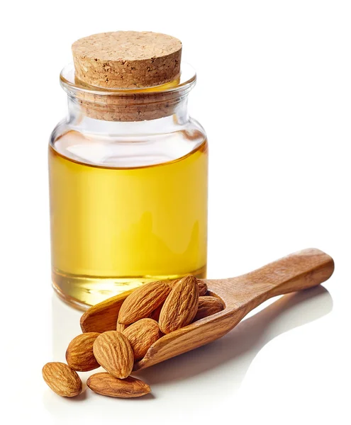 Almond oil and almonds — Stock Photo, Image