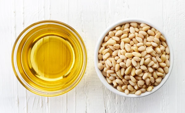Pine nut oil and pine nuts — Stock Photo, Image