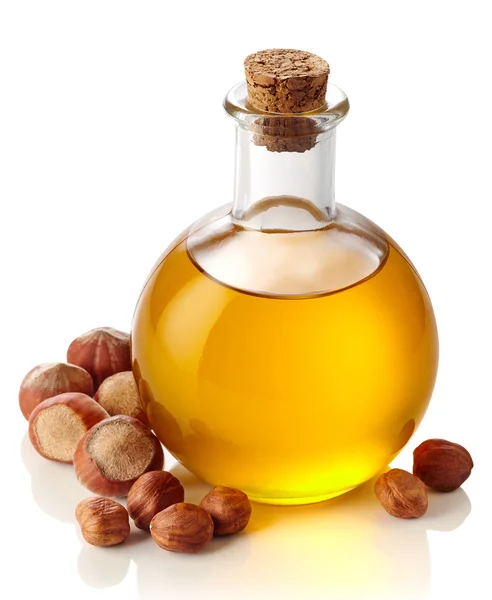 Hazelnut oil and hazelnuts — Stock Photo, Image