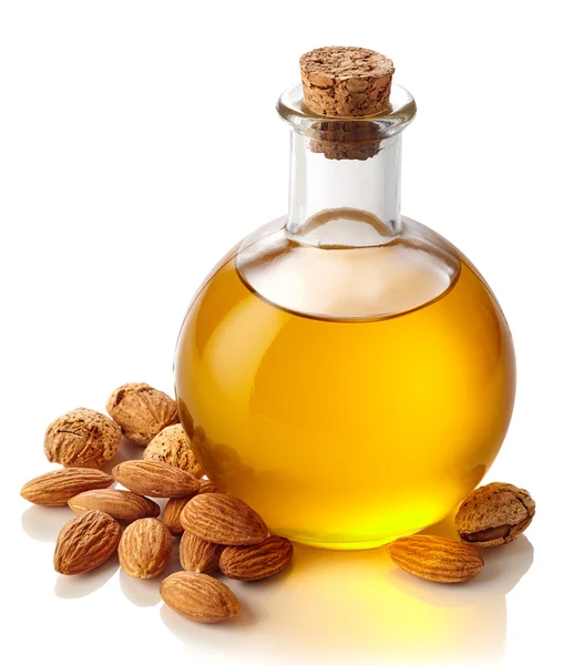 Almond oil and almonds — Stock Photo, Image