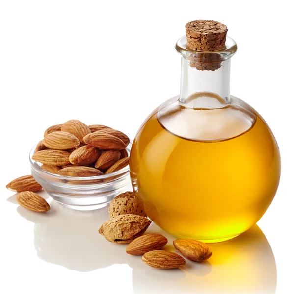 Almond oil and almonds — Stock Photo, Image