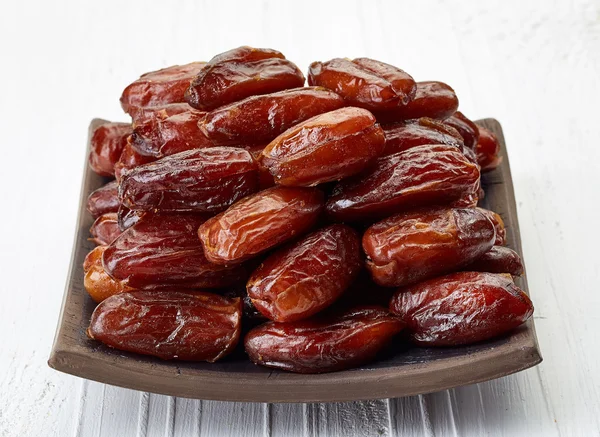 Plate of dried dates — Stock Photo, Image