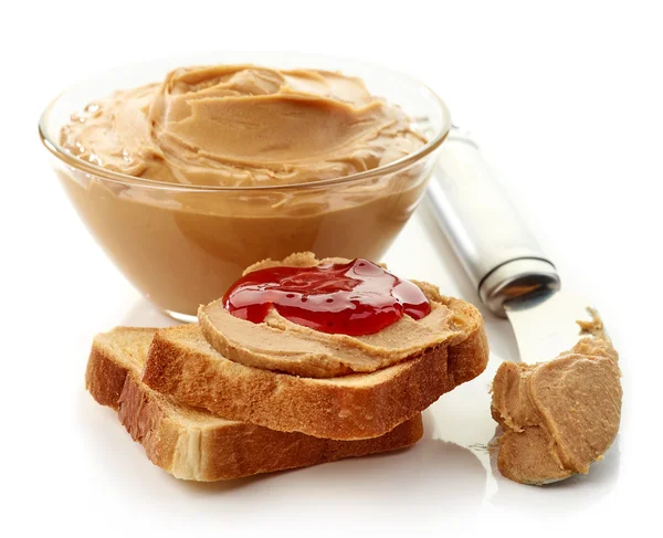 Peanut butter jelly sandwich, peanut butter and peanuts — Stock Photo, Image