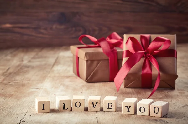 Gift boxes on wooden background — Stock Photo, Image