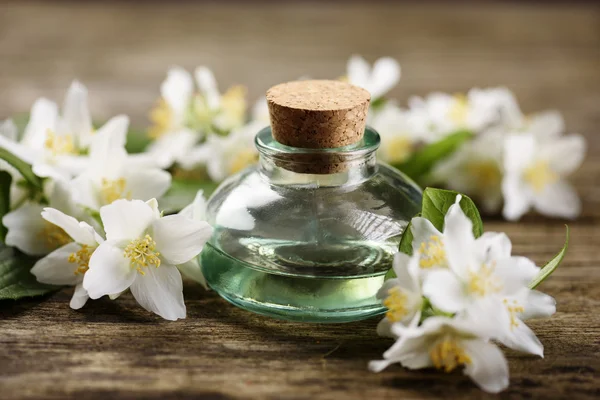 Aromatic Oil and jasmine flowers — Stock Photo, Image