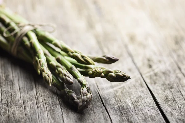 Asparagus on wooden table — Stock Photo, Image