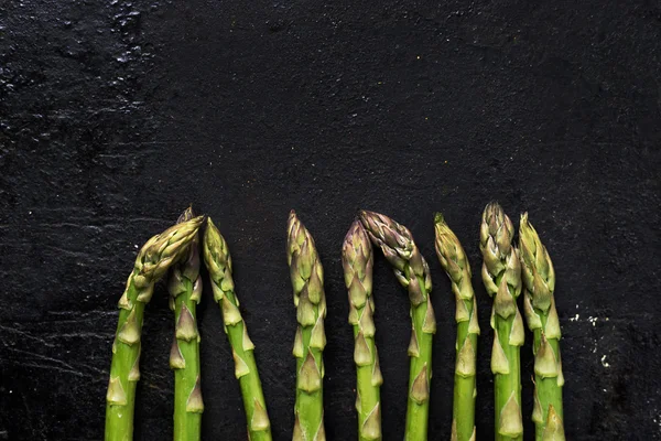 Asparagus on black board — Stock Photo, Image