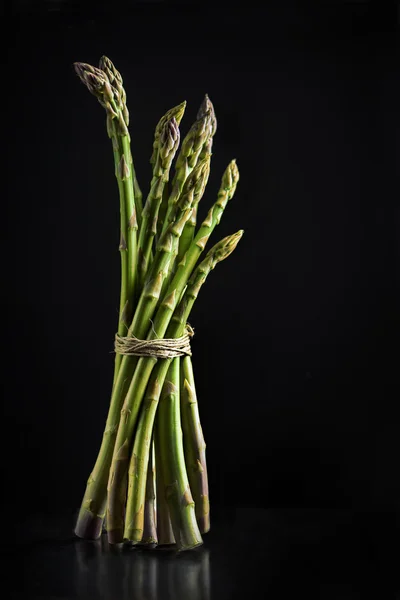 Asparagus on black background — Stock Photo, Image
