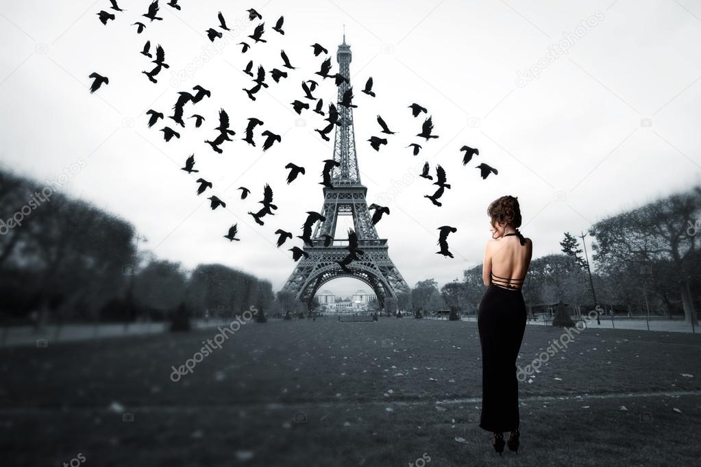 stylish girl stands in the center of Paris