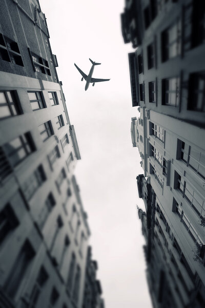 Plane over the city of Brussels tilt - shift