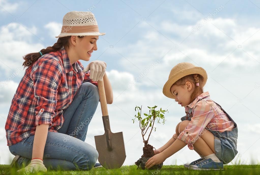 girl plant sapling tree