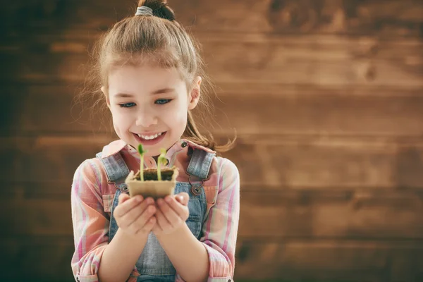 girl cares for plants