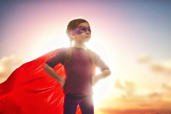 Girl plays superhero — Stock Photo, Image