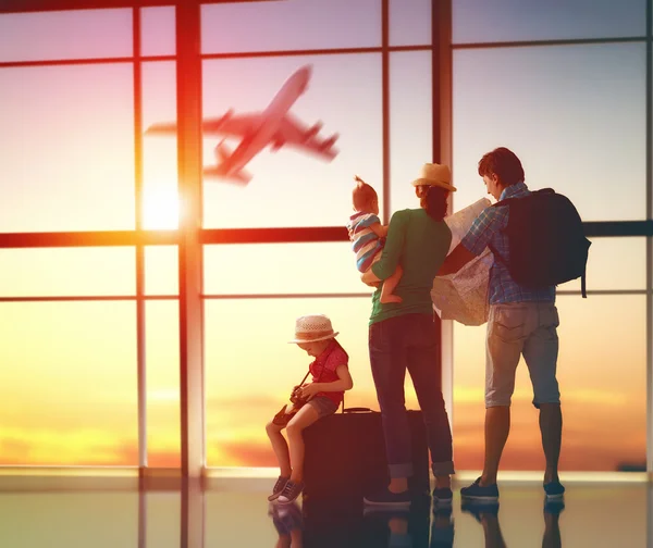 family with suitcases