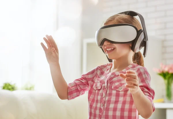 Girl playing in virtual reality glasses — Stock Photo, Image