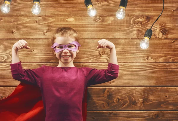 Girl plays superhero — Stock Photo, Image